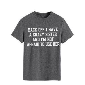 Detail of dark gray crewneck T-shirt featuring bold white letter print on the chest