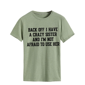 Detail of olive green heathered fabric and funny slogan print on crew neck t-shirt