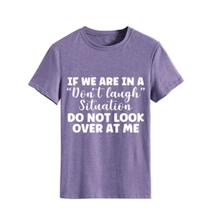 Detail of purple heathered t-shirt featuring bold white humorous text print design