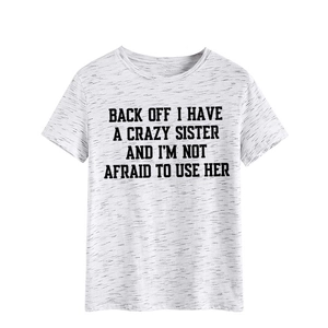 Detail of grey heather t-shirt featuring bold black slogan and soft cotton texture