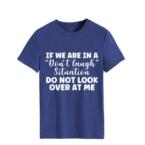 Detail of the white printed slogan on navy blue cotton crewneck casual short sleeve t-shirt