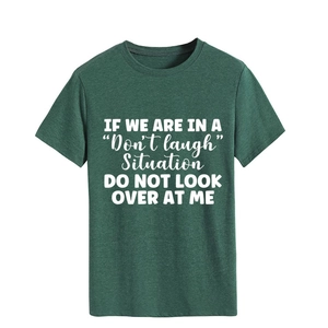 Detail of white humor quote print on a soft dark green crewneck short sleeve t-shirt