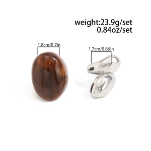 Detail showing amber resin texture and silver irregular metal ring with measurements