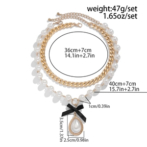 Detailed dimensions of layered gold chain and pearl necklace with bow and teardrop pendant