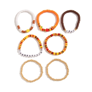 7-piece Thanksgiving bracelet set with maple leaf charms and autumn colored clay beads