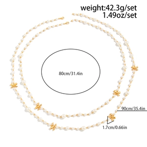 Detail view of layered pearl necklace with bow accents showing 80cm and 90cm lengths