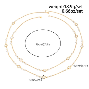 Detailed view of layered pearl sweater chain with 70cm and 90cm gold metal necklaces