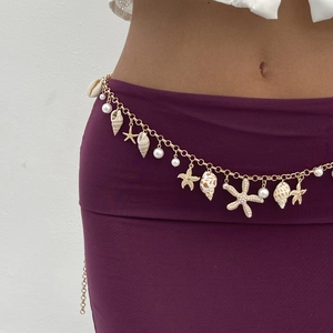 Golden bohemian body chain with starfish shell charms and white pearls for beach vacation