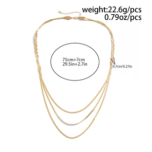 Detail of layered gold flat snake bone necklace showing weight and length specifications