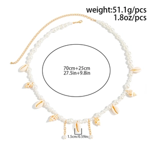 Detail of beach waist chain with sea shells, pearls and gold adjustable chain