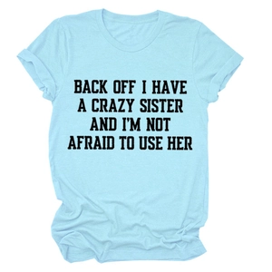 Detailed close-up of light blue cotton T-shirt featuring funny black quote letter print