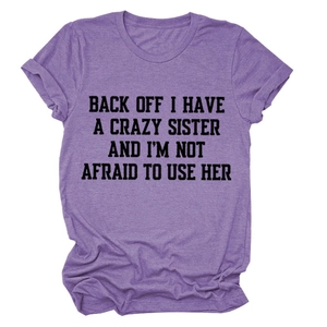 Detail view of heather purple cotton T-shirt with bold black letter print slogan