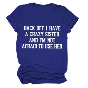 Detail of white humor quote print on a navy blue round neck short sleeve cotton T-shirt