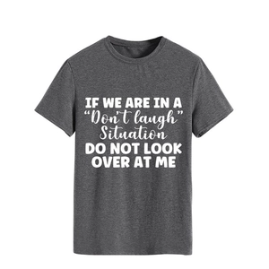 Close-up of white slogan print on a dark grey casual cotton crewneck t-shirt
