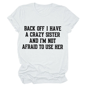 Detail of rolled sleeve and bold letter print on white round neck cotton t-shirt