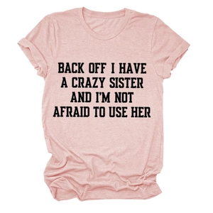 Close-up of heather pink T-shirt featuring high-quality black letter printing and crew neck