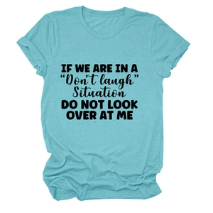 Detailed flat lay of cyan crewneck t-shirt featuring black slogan graphic print