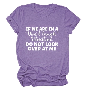 Close-up of the white 'Don't laugh' text print on this purple cotton casual t-shirt