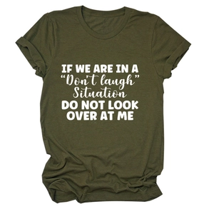 Close-up of olive green t-shirt fabric texture and printed white letter typography