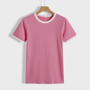 Pink short sleeve ringer t-shirt with white contrast trim on a wooden hanger