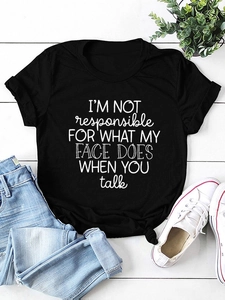 Flat lay of black cotton T-shirt with I'M NOT RESPONSIBLE slogan print and denim jeans