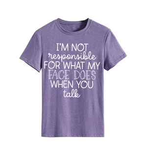 Close-up of purple crew neck T-shirt featuring I'm not responsible white printed slogan