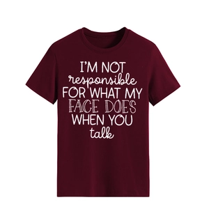 Detail of burgundy cotton T-shirt featuring white typographic I'm Not Responsible slogan