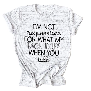 Detail of rolled sleeve cuff and slogan print on grey cotton crew neck t-shirt