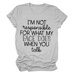 Detail of grey crewneck T-shirt showing I'M NOT RESPONSIBLE slogan print and fabric texture