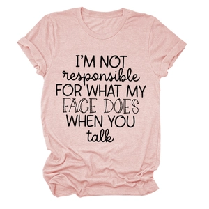 Close-up of pink cotton T-shirt featuring black I'M NOT RESPONSIBLE slogan print