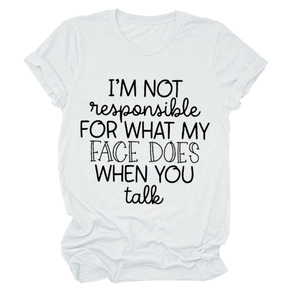 Close-up of white cotton T-shirt featuring 'I'M NOT responsible' slogan in black text