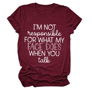 Detail of burgundy T-shirt showing rolled sleeve cuffs and white letter print
