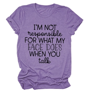 Close-up of purple cotton t-shirt fabric texture and black I'm Not Responsible lettering