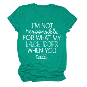 Detail of teal crewneck t-shirt with white text print and soft fabric folds