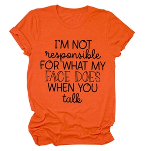 Detail of orange cotton T-shirt featuring I'M NOT RESPONSIBLE slogan print
