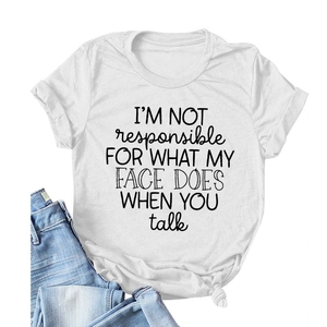 Flat lay of a white crew neck T-shirt with black slogan print paired with blue jeans
