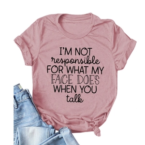 Minimalist cotton t-shirt in dusty pink featuring black typography with blue jeans