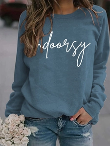 Detail of blue crewneck sweatshirt with white Indoorsy print and casual drop shoulder