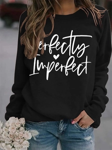 Detail of Perfectly Imperfect letter print and heart on women's black sweatshirt