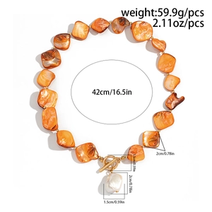 Detail shot of boho necklace with orange shells, baroque pearl, OT clasp and dimensions
