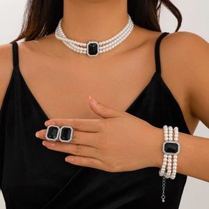 Elegant multi-layer faux pearl jewelry set with black gemstone and silver accents