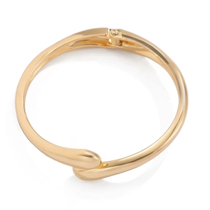 Minimalist irregular chunky golden bangle with smooth teardrop ends and polished finish