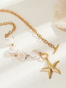 Detailed close-up of bohemian shell beads and textured starfish pendant with OT clasp
