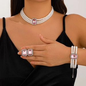 Three-layer faux pearl jewelry set with pink rectangular stones and matching rings