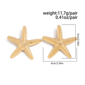 Detail of gold starfish earrings showing textured surface and dimensions 6cm x 6cm