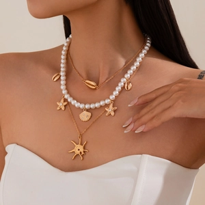 Three-layer ocean theme necklace with pearls, starfish pendants and shell charms for women
