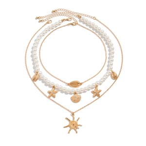 Layered beach necklace with faux pearls, golden starfish and seashell charms for women
