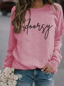 Detail of pink crewneck sweatshirt with indoorsy script print and ribbed sleeve cuffs