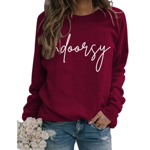 Detail of burgundy crewneck sweatshirt with white indoorsy print and soft knit texture