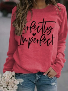 Detail of Perfectly Imperfect text print on dusty pink long sleeve crewneck sweatshirt